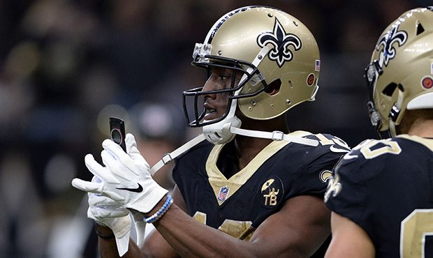 New Orleans Saints wide receiver Michael Thomas (13) pulls out a cell phone after his 72 yard touch...