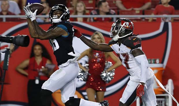 Jacksonville Jaguars wide receiver Montay Crockett (16) makes a catch over Tampa Bay Buccaneers' Da...