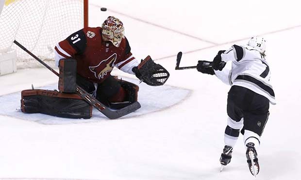 Los Angeles Kings center Tyler Toffoli (73) shoots wide of Arizona Coyotes goaltender Adin Hill (31...