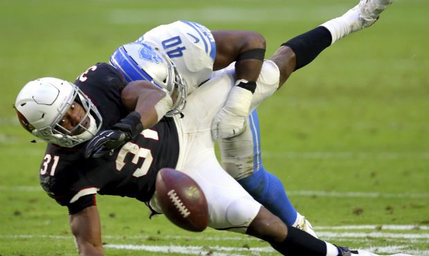Arizona Cardinals running back David Johnson (31) is hit by Detroit Lions middle linebacker Jarrad ...