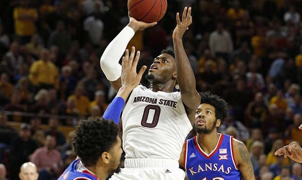Arizona State guard Luguentz Dort (0) drives on Kansas guard Devon Dotson (11) during the second ha...
