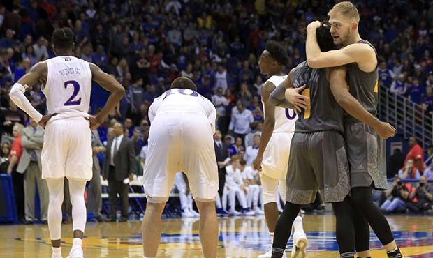 Arizona State guard Kodi Justice, right, hugs guard Remy Martin (1) during the final seconds of an ...
