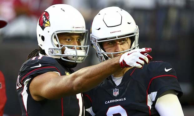Arizona Cardinals wide receiver Larry Fitzgerald and quarterback Josh Rosen (3) talk it over prior ...