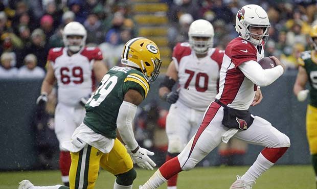 Arizona Cardinals quarterback Josh Rosen, right, breaks free for a long run during the second half ...