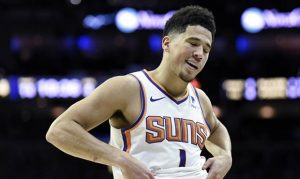 Devin Booker's back added to long list of injuries for young Suns star