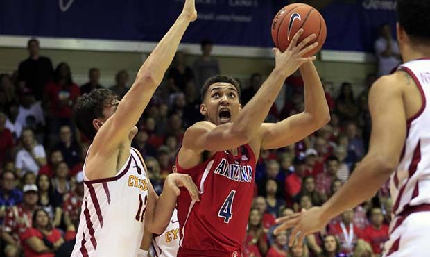 Iowa State forward Michael Jacobson (12) can't keep Arizona center Chase Jeter (4) from shooting du...