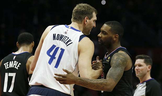 Los Angeles Clippers guard Sindarius Thornwell, second right, congratulates Dallas Mavericks forwar...