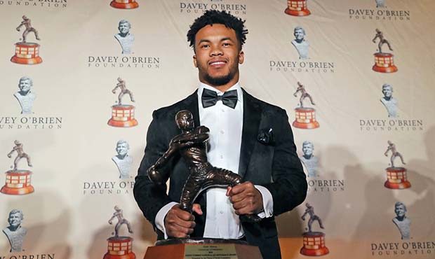 Heisman Trophy winner quarterback Kyler Murray posses with the Davey O'Brien football award he rece...
