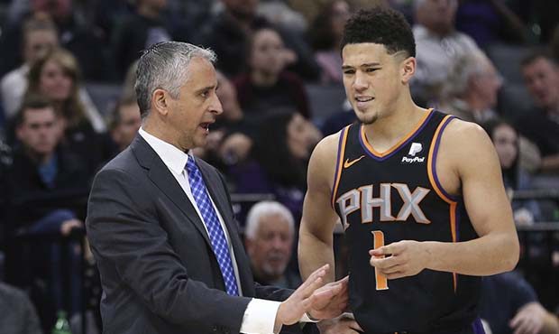 Phoenix Suns head coach Igor Kokoskov talks with Suns guard Devin Booker during the second half of ...