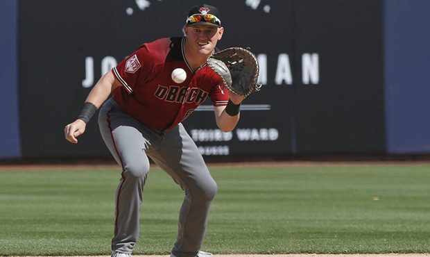 Arizona Diamondbacks first baseman Kevin Cron fields a ground ball hit by Milwaukee Brewers' Corey ...