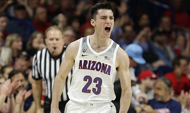 Arizona guard Alex Barcello reacts after making a 3-point basket against Oregon State during the se...