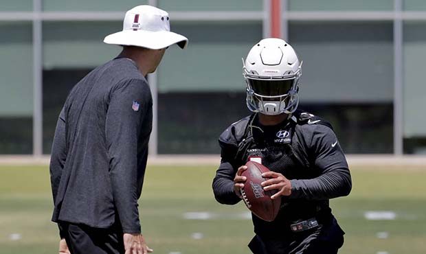 Arizona Cardinals' Kyler Murray works on his footwork as head coach Kliff Kingsbury looks on during...