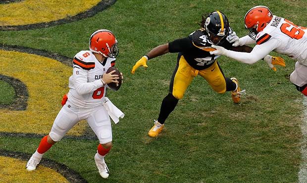 Bud Dupree #48 of the Pittsburgh Steelers is held in the end zone by Desmond Harrison #69 of the Cl...