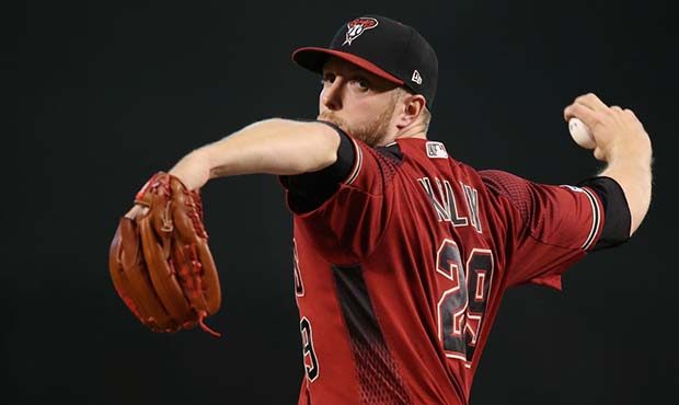 PHOENIX, ARIZONA - JUNE 23:  Starting pitcher Merrill Kelly #29 of the Arizona Diamondbacks throws ...
