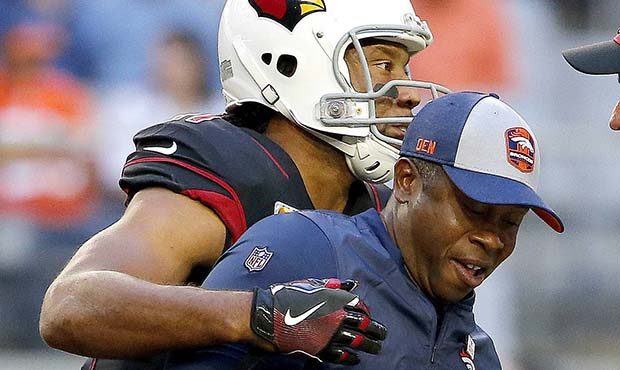 Arizona Cardinals wide receiver Larry Fitzgerald hugs Denver Broncos head coach Vance Joseph prior ...