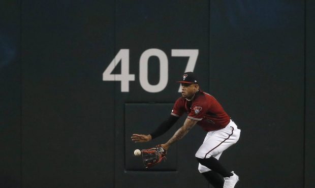 Arizona Diamondbacks center fielder Ketel Marte makes a running catch on a ball hit by Milwaukee Br...