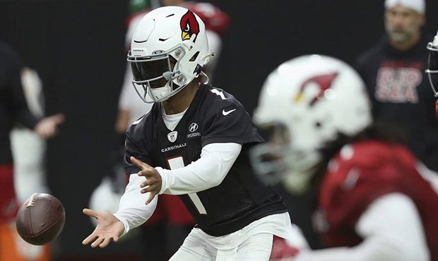 Arizona Cardinals quarterback Kyler Murray, left, takes the snap as Cardinals wide receiver Larry F...