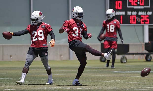 Arizona Cardinals' David Johnson (31) and Chase Edmonds (29) workout during an NFL football practic...
