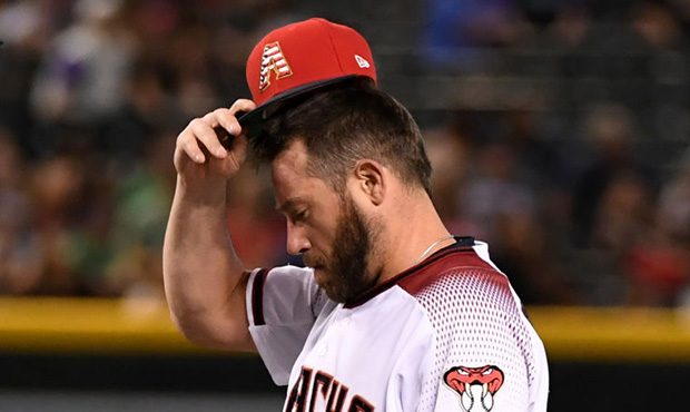 PHOENIX, ARIZONA - JULY 07:  Greg Holland #56 of the Arizona Diamondbacks prepares to step onto the...
