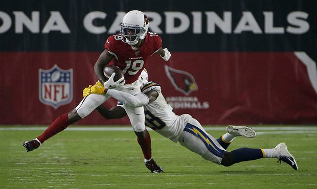 Arizona Cardinals wide receiver KeeSean Johnson (19) is hit by Los Angeles Chargers defensive back ...