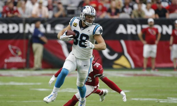 Carolina Panthers tight end Greg Olsen (88) runs as Arizona Cardinals free safety D.J. Swearinger (...