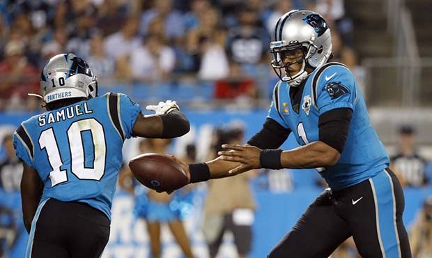 Carolina Panthers quarterback Cam Newton (1) hands off to wide receiver Curtis Samuel (10) during t...