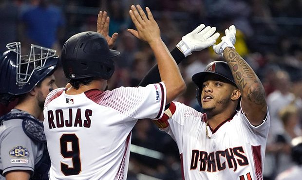 Arizona Diamondbacks' Ketel Marte, right, celebrates with Josh Rojas (9) after hitting a two-run ho...