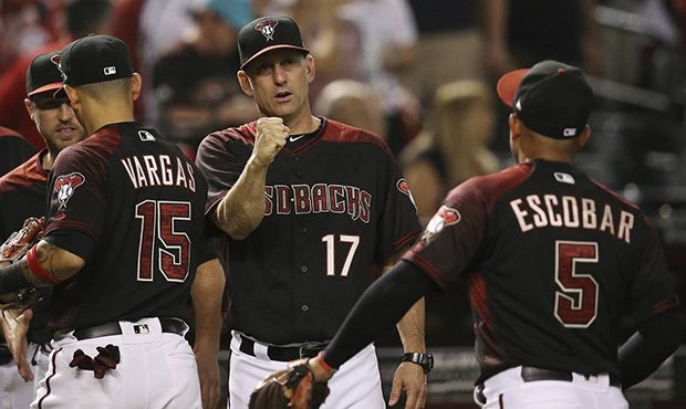 Arizona Diamondbacks manager Torey Lovullo (17) celebrate a win against the Cincinnati Reds with qu...