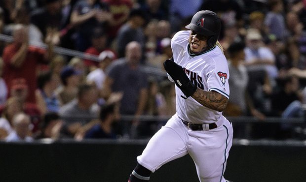 Ketel Marte #4 of the Arizona Diamondbacks rounds third base to score against the Miami Marlins in ...