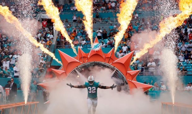 Kenyan Drake #32 of the Miami Dolphins takes the field for their game against the New England Patri...