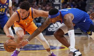 Suns refuse to die, grind to OT loss in first game without suspended Ayton
