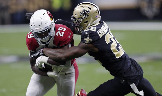 New Orleans Saints defensive back Chauncey Gardner-Johnson (22) tackles Arizona Cardinals running b...