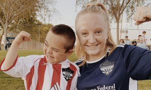 Casteel sophomore soccer player uses hands to communicate with buddy