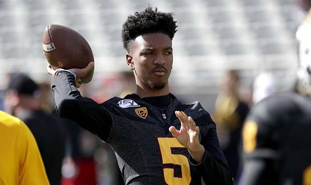 Arizona State quarterback Jayden Daniels (5) warms up his teammates prior to an NCAA college footba...