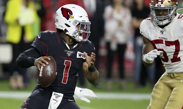 Arizona Cardinals quarterback Kyler Murray (1) avoids the hit of San Francisco 49ers defensive tack...