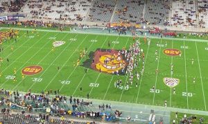 Arizona players tear up Sparky logo at midfield before Territorial Cup