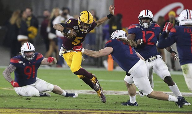 Arizona State's Jayden Daniels (5) runs against Arizona's defense during the first half of an NCAA ...