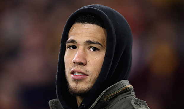 NBA athlete, Devin Booker of the Phoenix Suns attends the NCAAF game between the Arizona State Sun ...