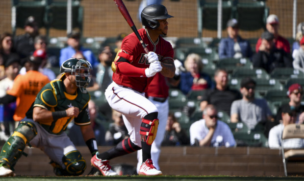 SCOTTSDALE, ARIZONA - FEBRUARY 23: Ketel Marte #4 of the Arizona Diamondbacks singles in the second...