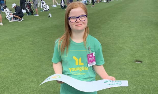 Christina Clapp, 19,  prepares to deliver Aaron Wise’s nameplate to his spot at the driving range...