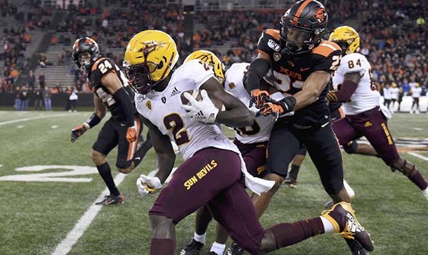 Arizona State wide receiver Brandon Aiyuk dashes past Oregon State defensive back Isaiah Dunn durin...
