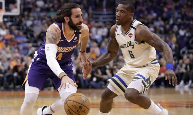 Phoenix Suns guard Ricky Rubio drives as Milwaukee Bucks guard Eric Bledsoe (6) defends during the ...