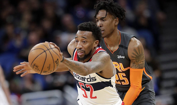 Washington Wizards guard Jordan McRae (52) is fouled by Orlando Magic forward Wes Iwundu, right, as...