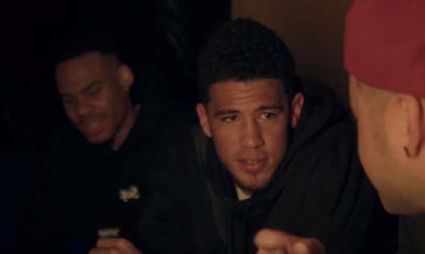 Screenshot of Suns guards Devin Booker and Elie Okobo in "Chicago Freestyle" music video by Drake...