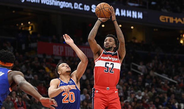 Washington Wizards guard Jordan McRae (52) shoots next to New York Knicks forward Kevin Knox II (20...