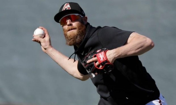 Arizona Diamondbacks' Archie Bradley throws during spring training baseball practice, Sunday, Feb. ...