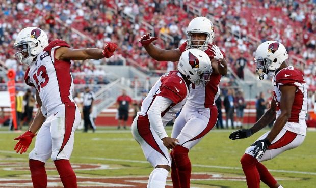 Quarterback Kyler Murray #1 of the Arizona Cardinals is congratulated by KeeSean Johnson #19, Larry...