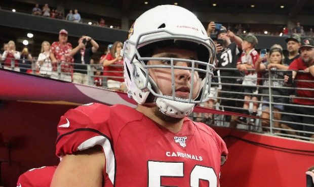 Center Mason Cole #52 of the Arizona Cardinals  walks out to the NFL preseason game against the Oak...