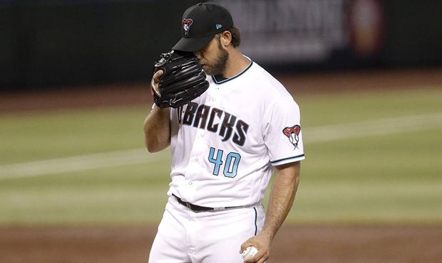 Arizona Diamondbacks starting pitcher Madison Bumgarner (40) looks away in between pitches against ...