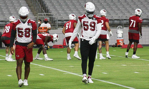 Arizona Cardinals linebackers Jordan Hicks (58) and De'Vondre Campbell (59) warm up during 2020 tra...